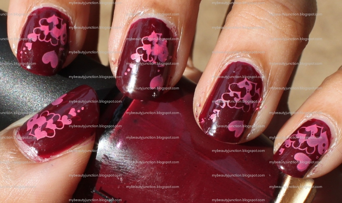 Manicure: O.P.I. Mrs O'Leary's BBQ nail polish with pink heart stamping nail art