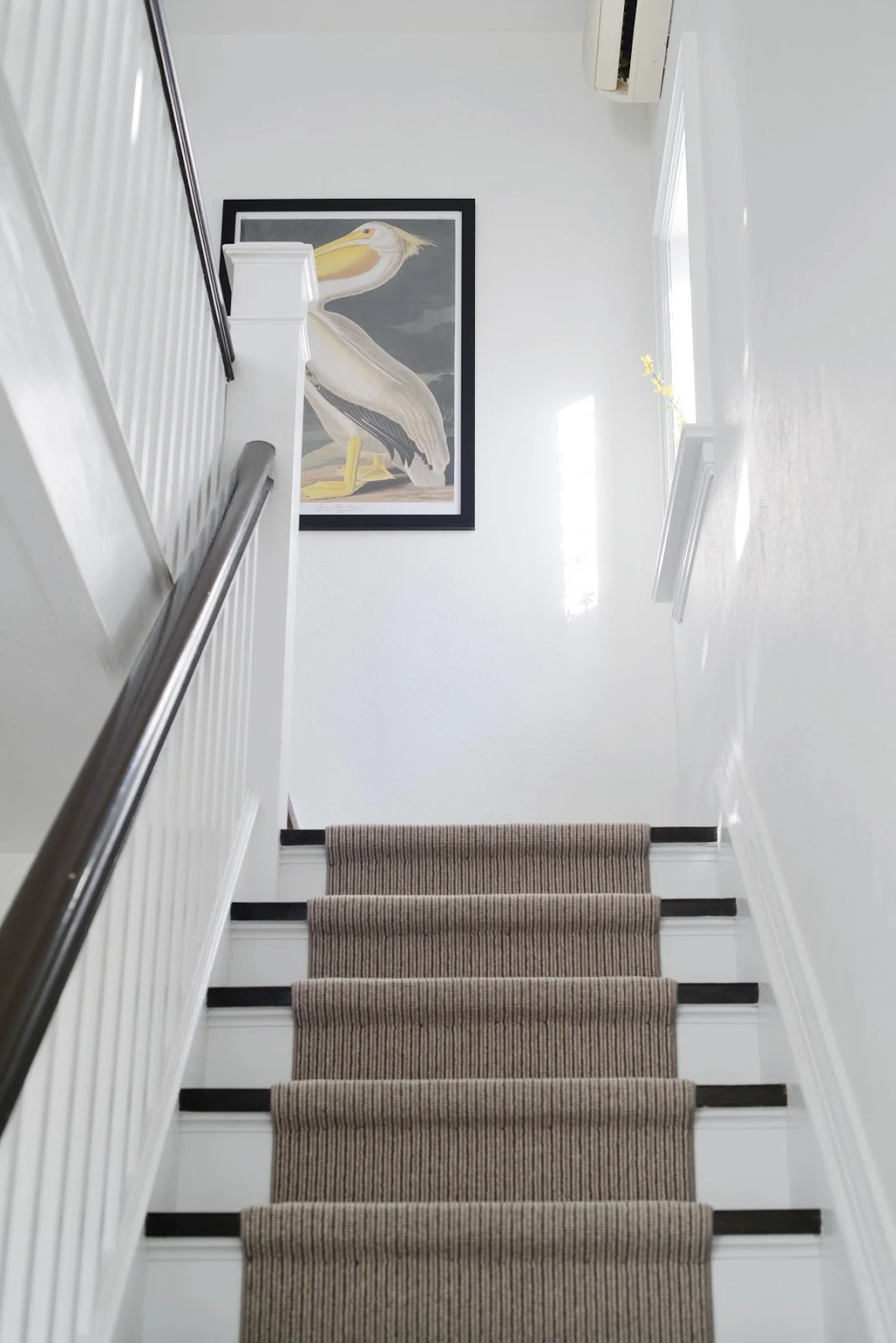 large scale art at top of stairwell | RamblingRenovators.ca