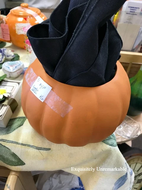 Thrift store pumpkin cookie jar on store shelf