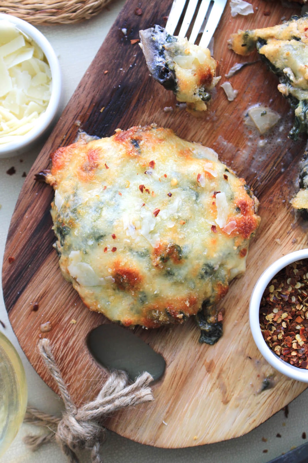 Spinach and Cheese Stuffed Portobello Mushrooms make a rich and decadent side dish or light main dish! The creamy, cheesy filling paired with the earthy mushrooms is ridiculously good!