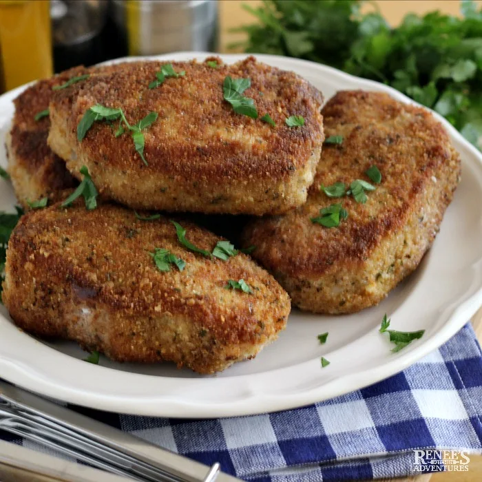 Breaded Oven Baked Pork Chops on a white plate