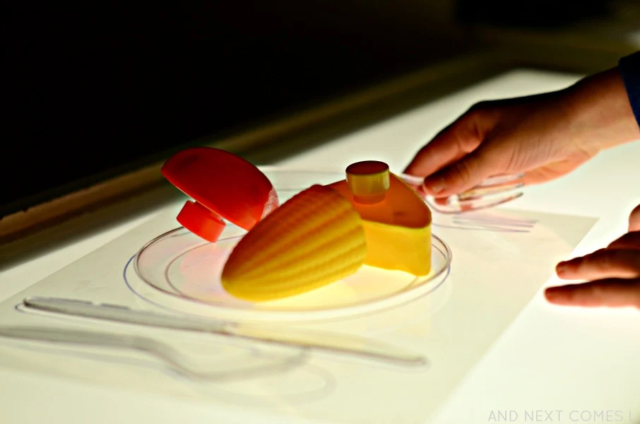 Play food on the light table from And Next Comes L