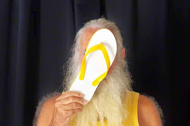 yellow flip-flop, yellow shirt, bearded dude