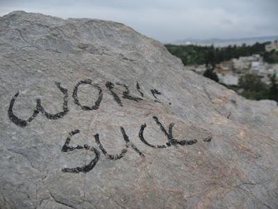 World sucks, a statement painted on a stone in Athens during the 2008 Greek riots