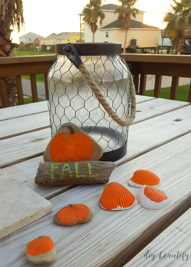 pumpkins painted onto rocks and shells