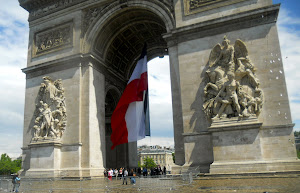 Fr. flag flying in the Arc de Trioumphe on the anniv. of D Day.