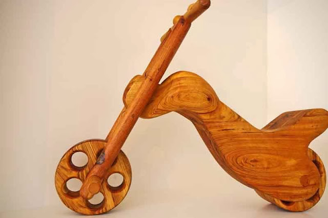 wood carving of scooter