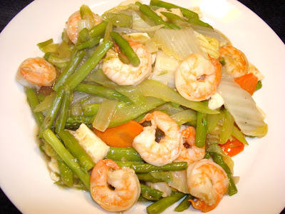 PORTIONS: 3 INGREDIENTS 12 oz shrimps, peeled and deveined 12 oz tofu, diced cooking spray ½ cup onions sliced 2 cups celery, sliced diagonally ½ carrots, thin sliced diagonally 1 cup Napa cabbage (Chinese cabbage) 1 lb asparagus, cooked and cut in 2" pieces 1 tsp vegetable oil 1 tsp minced ginger 2 cups chicken broth, without salt ½ tsp salt 1 tbsp soy sauce 3 ½ tbsp oyster sauce 2 ½ tbsp cornstarch 2 ½ tbsp water PREPARATION  MAKE SAUCE FIRST In a small pot at medium temperature, heat the oil, and saute the ginger for 30 seconds. Add chicken broth, salt, soy sauce, oyster sauce, let it boil Mix the cornstarch with cold water and stir into the sauce, let it thick and cook for a minute. SAUTE THE SHRIMPS WITH THE TOFU AND VEGETABLES In a large saute pan spray it lightly with cooking oil. Add onions and cook for a minute. Add shrimps, celery, carrots, napa cabbage and cook until shrimps are done. Add tofu, asparagus, heat it up. Stir in enough sauce to coat the food and serve. 