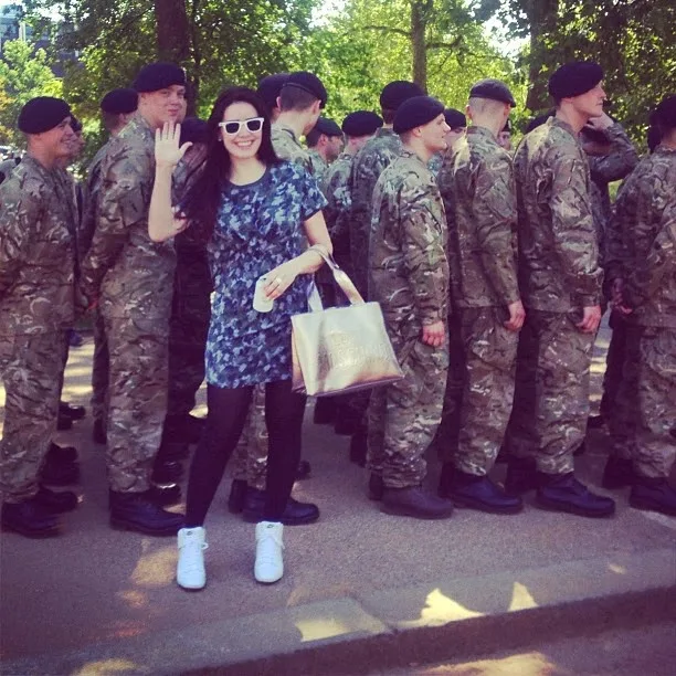 Fashion blogger Emma Louise Layla Karl Lagerfeld camouflage dress with the army boys in Hyde Park, London