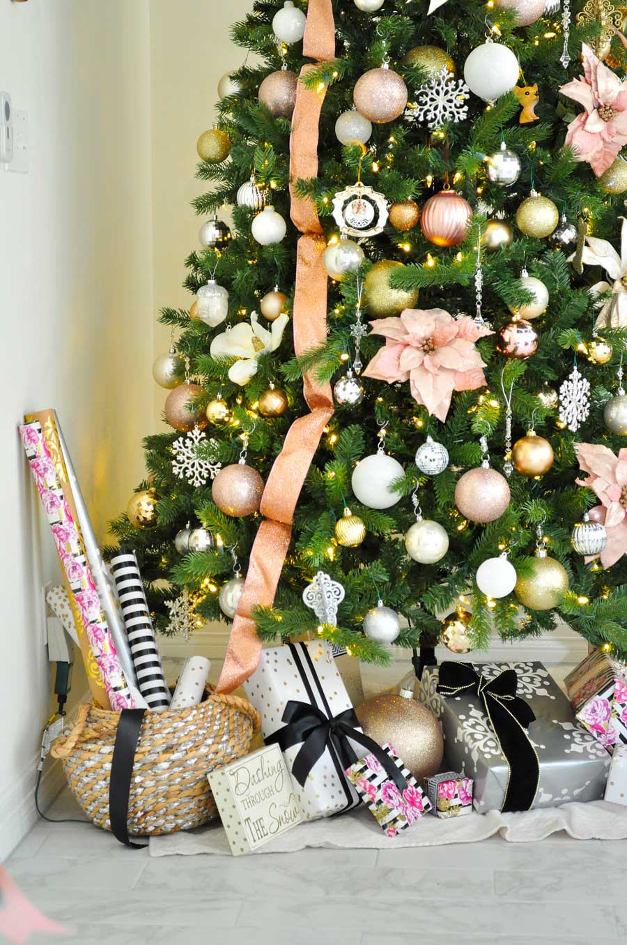 A lucite star tops this blush pink themed Christmas tree filled with pink and white poinsettias plus gold, silver and white ornaments. Such a feminine and classy look! A lucite star tops this blush pink themed Christmas tree filled with pink and white poinsettias plus gold, silver and white ornaments. Such a feminine and classy look!
