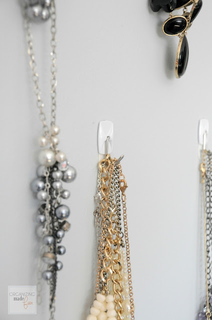 Jewelry organized behind the door with hooks