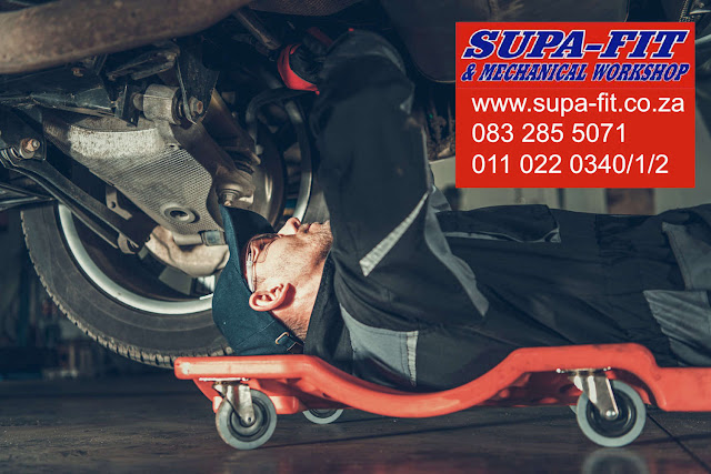 Supa-Fit Mechanical Workshop - mechanic working under a car