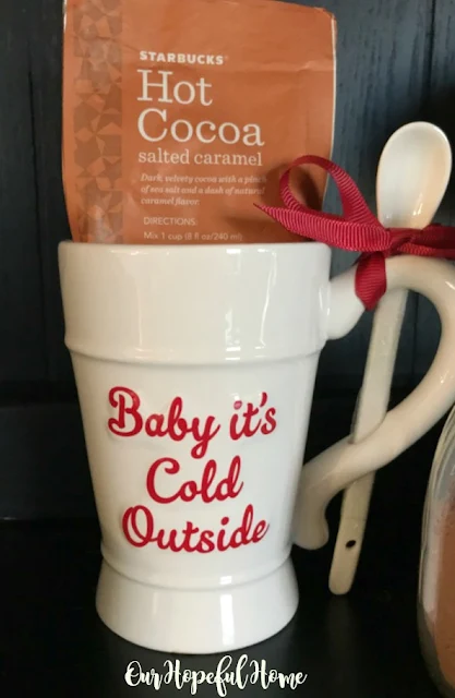 Baby It's Cold Outside mug with attached spoon and Starbucks salted caramel powdered cocoa mix