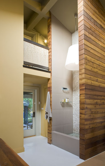 Sustainable cedar wood surrounds the two-story shower in this eco-friendly home spa designed by Washington, DC architect Ernesto Santalla