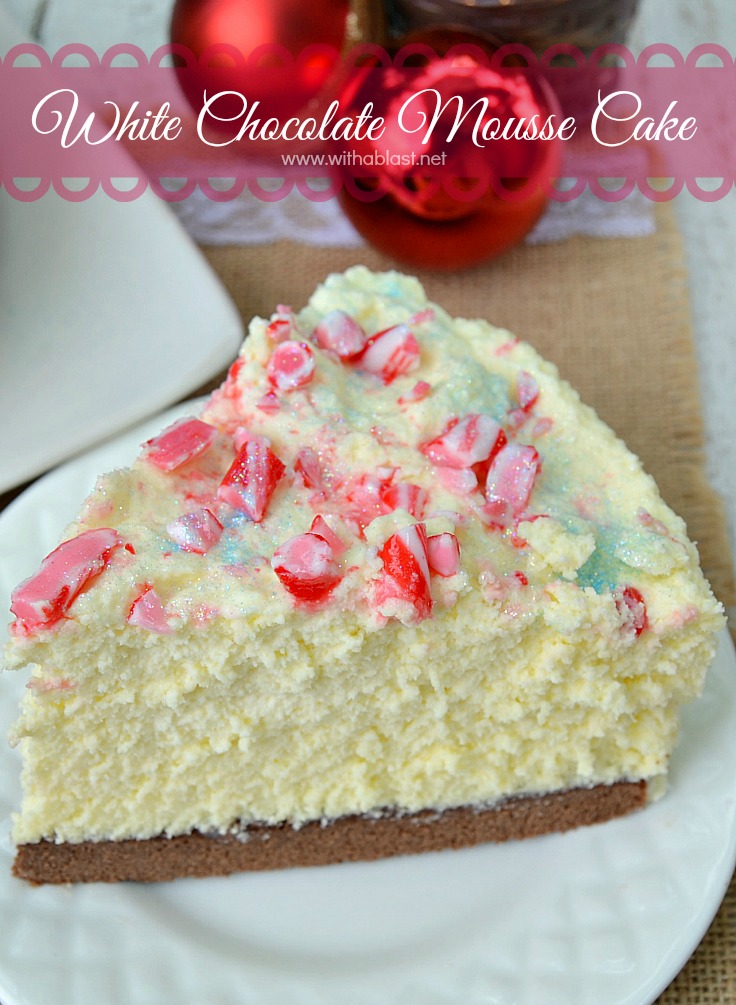 White Chocolate Mousse Cake has a chewy Cake base, creamy Mousse and a taste which will blow you away ~ make-ahead friendly recipe #Mousse #MouseCake #WhiteChocolateMousse #WhiteChocolateDessert #HolidayDessert #HolidayCake