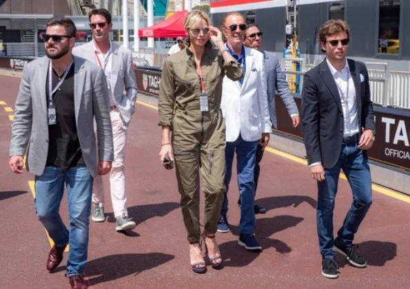 Princess Charlene wore Ralph Lauren Olive Cotton Twill Military Coverall. Prince Jacques and Princess Gabriella wore Ray-Ban sunglasses.