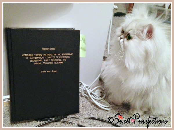 Brulee says Cat Ladies are smart Brulee, pictured with dissertation, says Cat Ladies are smart!