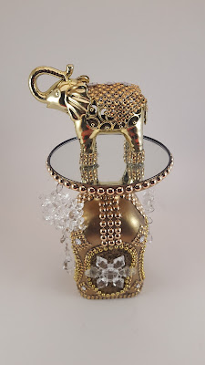  Botella decorativa dorada con elefante