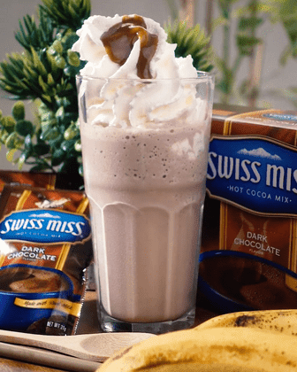 A glass of Swiss Miss Banana Chocolate Smoothie