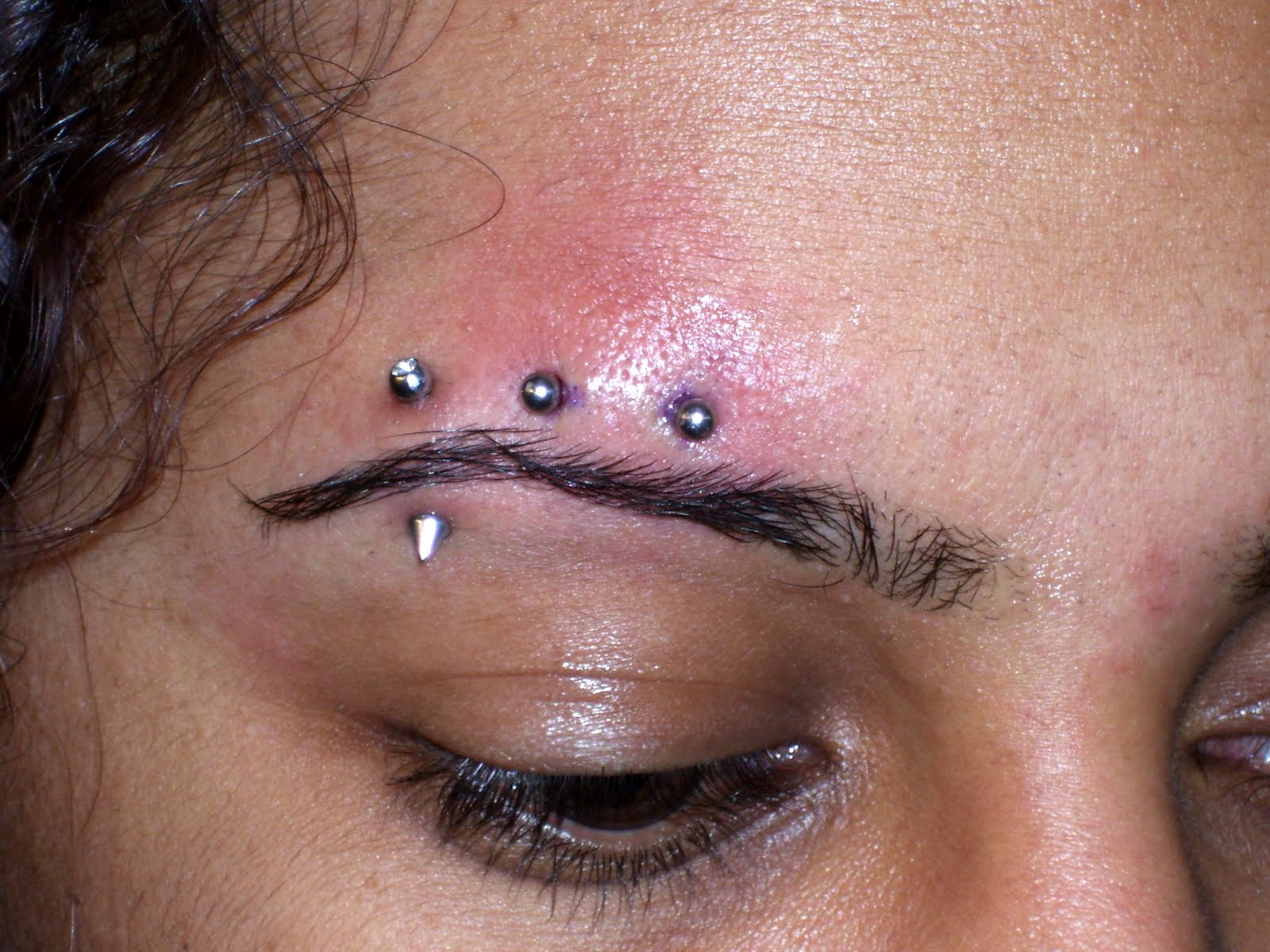 Heritage Tattoo: Eyebrow Piercing