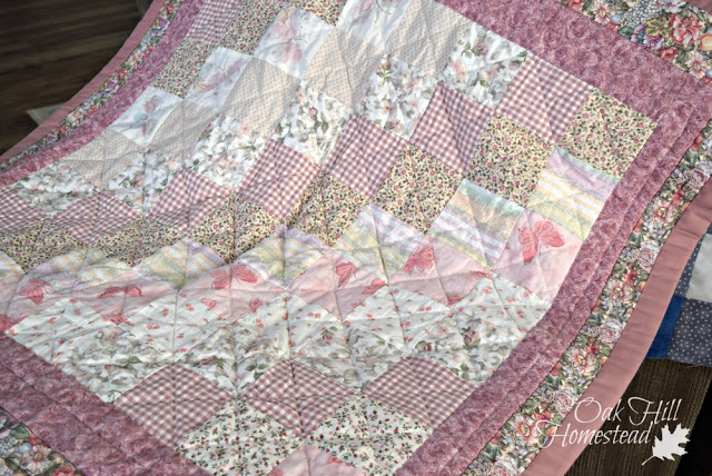 A pink and white crib quilt