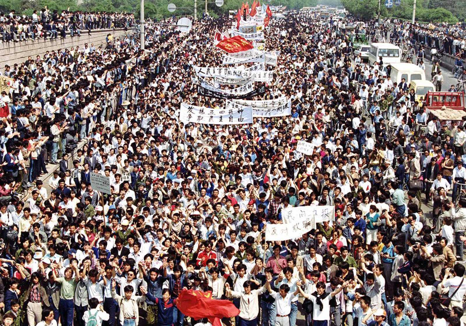 Thousands of students from local colleges and universities march to Tiananmen Square, Beijing, on May 4, 1989, to demonstrate for government reform.