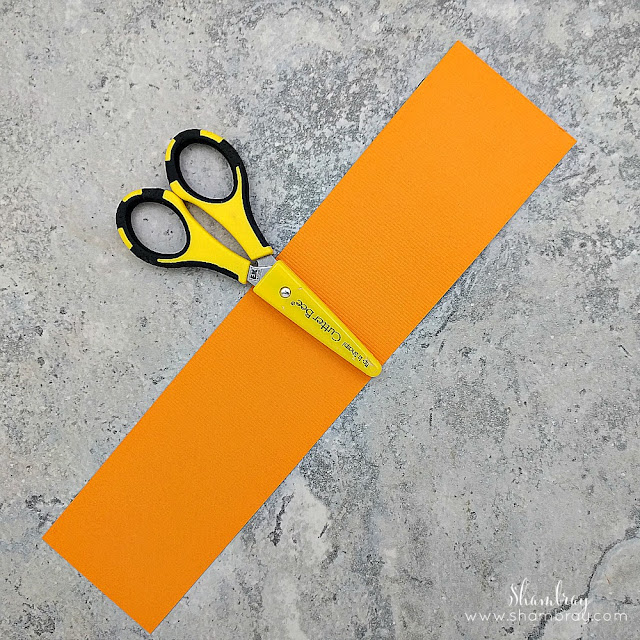 Orange paper and scissors 