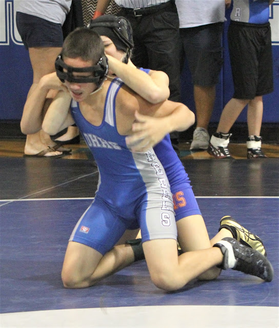 Men Wrestling Women Female wrestler battles male on the mat