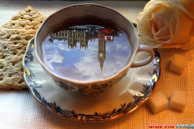 big ben reflection in a cup of tea