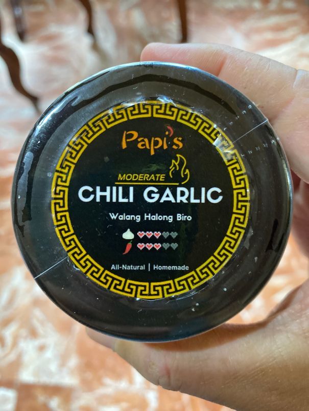 A small bottle of moderate spice level Papi's Chili Garlic