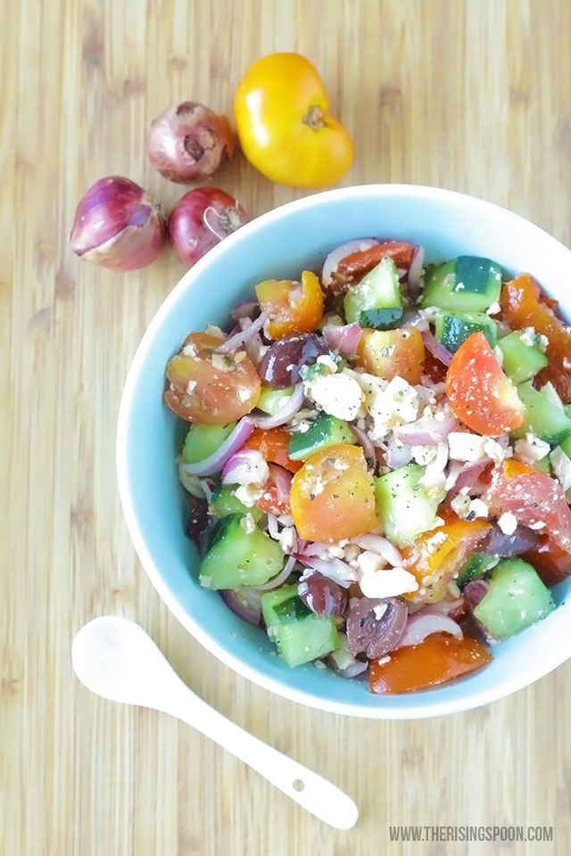 A healthy and refreshing Greek salad with chunky cucumber and tomato, sliced red onion, feta cheese, kalamata olives, and a garlic infused red wine vinaigrette dressing that only takes minutes to make.