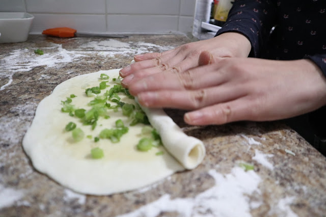 roll up the green onion cake lengthwise