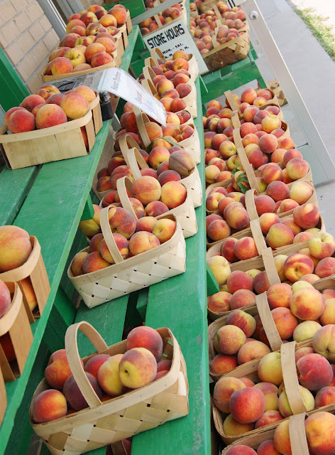 Baskets of Fresh Peaches at a Peach Stand Image
