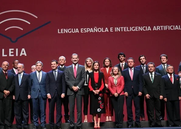 Queen Letizia wore Zara cape style jacket in black and Hugo Boss Banora gathered silk blouse and black floral skirt