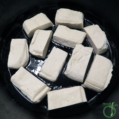 Morsels of Life - Sofritas Step 4 - Cut tofu into quarters, and pan fry until sides crisp. (Optional - I only pan fried the two sides with a larger surface area and not all six sides.)