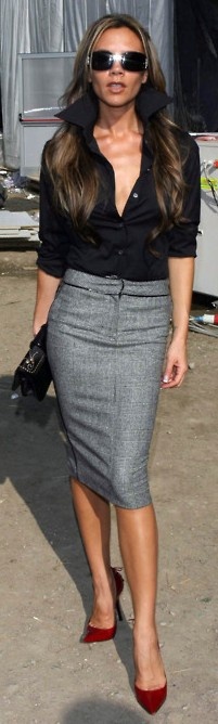 Victoria Beckham in a grey pencil skirt and black blouse | Just a ...