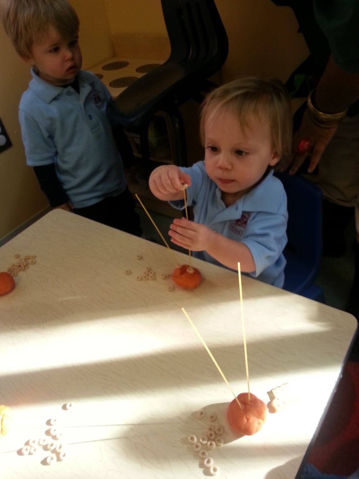 to the HH Toddler Classroom! Threading Beads, Stacking Cheerios on spaghetti noodles