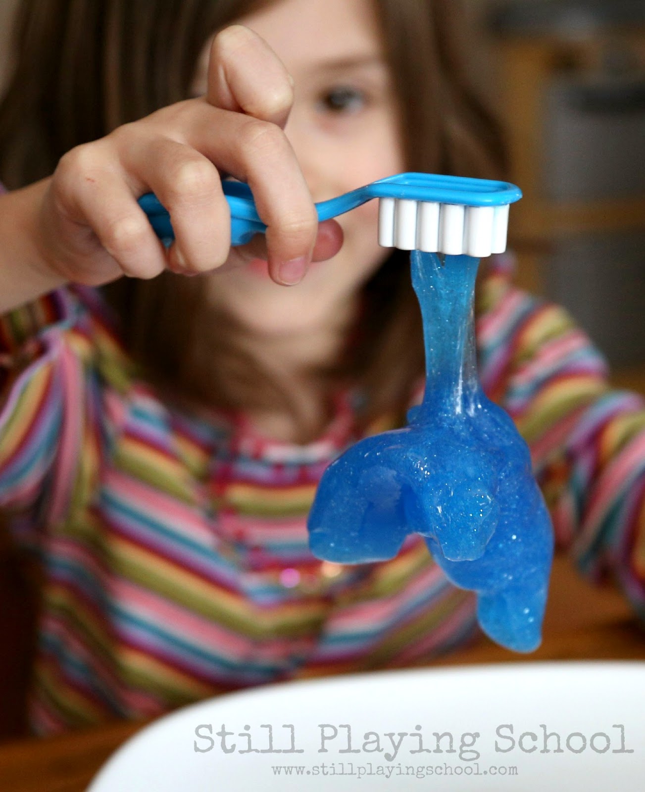 Toothpaste Slime for Dental Health Month Still Playing School