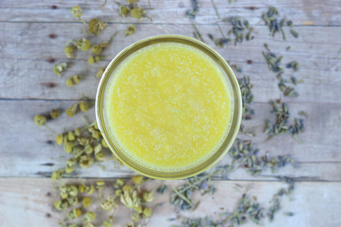 How to make diy after sun balm with calendula and lavender. Use this natural herbal remedies like you would a lotion for sunburn relief.  This homemade salve for skin has coconut oil, shea butter, and aloe vera for skin.  This ater sun salve is a must for summer!  #diy #skincare #herbal #lavender #calendula