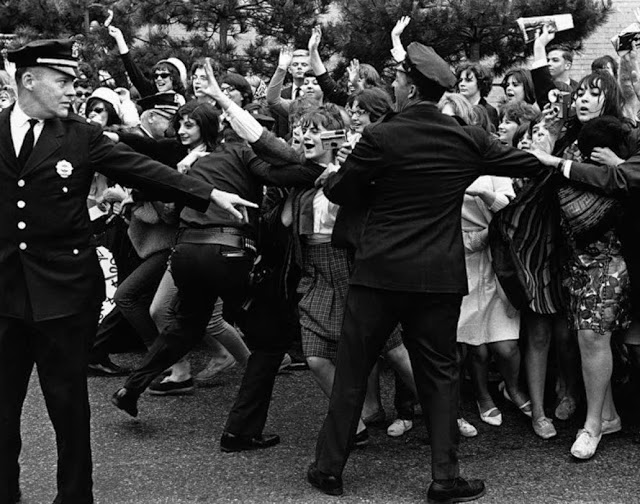 American policemen holding back young Rolling Stones fans in New York 1964. Pirate Radio and Sealand and Other stories of Rock, Radio, and Regulations. Marchmatron.com American policemen holding back young Rolling Stones fans in New York 1964. Pirate Radio and Sealand and Other stories of Rock, Radio, and Regulations. Marchmatron.com