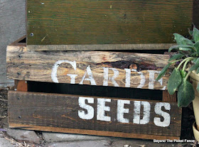 old sign stencils create a vintage crate made from reclaimed wood