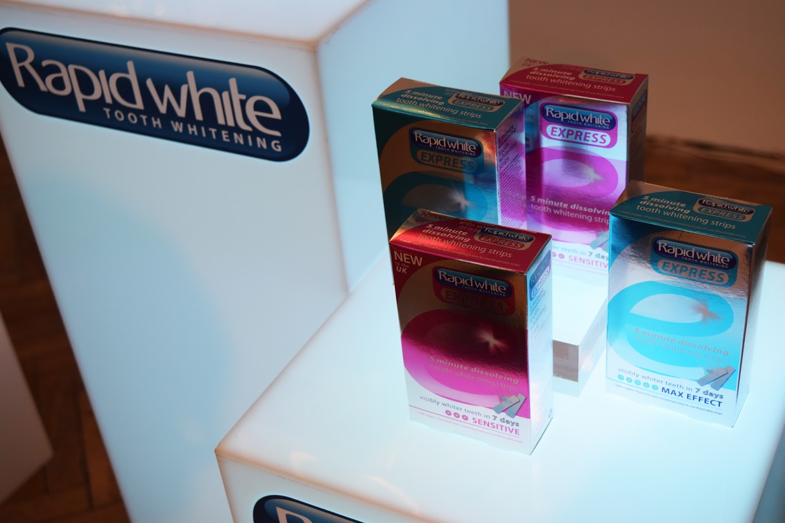 a rapid white stand showing their range of teeth whitening kits