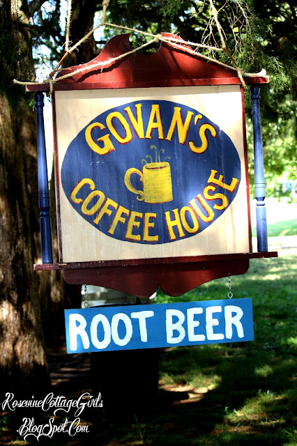 A hand painted sign that reads Govan Coffee House and Root Beer at the Rock Castle Living History Event