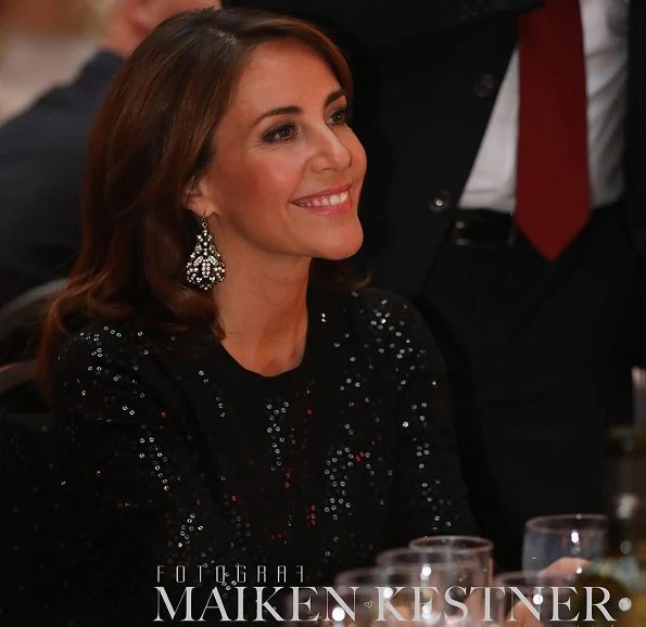 Princess Marie wore Marchesa notte Long-sleeved tops. Generation Love Black Glitter Mesh Long Sleeve Sweater and trousers, gold earrings