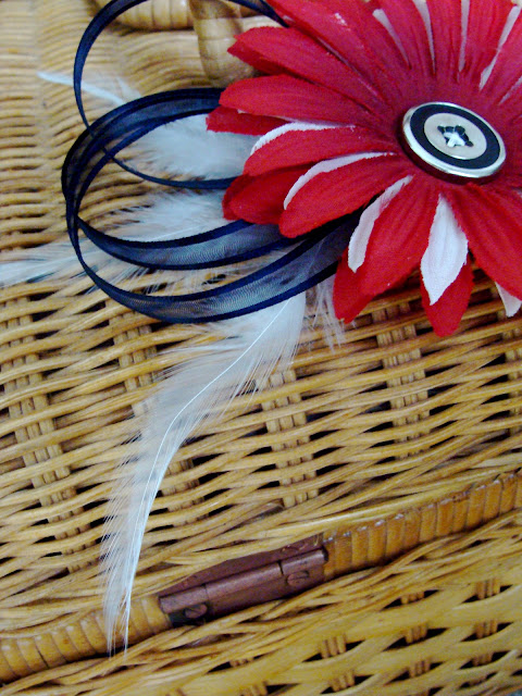 red, white, and blue 4th of July hair flower with feathers, ribbon, and vintage button center