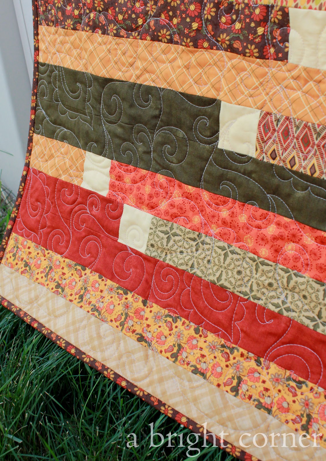 Jelly Roll Race Quilt in lovely fall colors!
