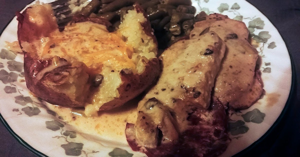 smothered capicola pork chops baked potatoes with gravy and green beans