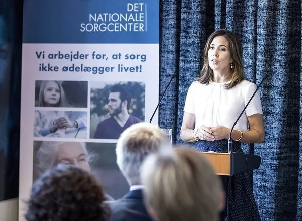 Crown Princess Mary of Denmark attended the opening of a new Grief Center. Princess wore Hugo Boss blouse, blue skirt