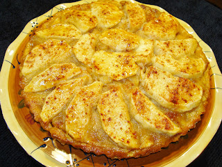 APPLE TART INGREDIENTS FOR THE DOUGH 1¼ cup flour ½ cup confectioner sugar 4 tbsp. cold unsalted butter 1/4 tsp. salt, if you use butter without salt 2 - tbsp. yogurt or sour cream PREPARATION OF THE DOUGH In a food processor, combine flour, sugar, salt and use the pulse bottom pressing it about 6 times. Cut in  the butter and pulse the button until the mixture forms large, coarse crumbs. Place the dough in between two pieces of l baking paper sheets or plastic wrap, and press the dough forming a 5" disk, and refrigerate it for about for about 35 minutes.  Lightly dust with flour the table surface. Pull the dough out the refrigerator and place it at working table and dust the top with flour.  With a rolling pin form an 11" round dough.  Put the rolling pin at the end of the dough and roll the dough around it.  Place the dough on top an 9" inches tart pan and unroll it.  Lightly press the dough to the bottom and sides of the tart pan. With a fork pinch the bottom of the dough on several places and put it in freezer for 20 minutes. Preheat the oven at 400° F and cook the dough for about 8 minutes. The dough will rise at the center. With a fork pinch it to let the air  out and the dough will fall back into the pan. Finish cooking the dough for another 8 minutes. Let it cool. INGREDIENTS FOR THE APPLE FILLING 1 tbsp. butter 2 big apples. Smith or Fuji apples, peeled and diced. 2 big apples, Smith or Fuji apples, peeled and cut in wedges. ½ cup sugar 1tsp. cinnamon powder  ¼ tsp. All Spice powder ¼ tsp. ground cloves 1½ tbsp. cornstarch 1 tbsp. lime juice 2 tbsp. apricot marmalade 2 tbsp. hot water APPLE FILLING AND TART PREPARATION Heat up  a saute and melt the butter In the pan combine the diced apples with the sugar ( save 2 tbsp ) and 3/4 tsp cinnamon. Cook the apples al dente and combine it with the cornstarch. Cook for a minute and let it cool. Fill the tart with the cook apples. Mix the apples with the lime juice and fan it on top of the cooked apples. Combine the 2 tbsp of sugar with ¼ tsp. cinnamon, all spice powder and sprinkle on top of the fanned apples. Preheat the oven at 375° F. Cook the tart for about 18 minutes, just enough to cook the apples. Let it cool. Dissolve the peach marmalade with the hot water. With a pastry brush dip it in the apricot marmalade and glace the top of the tart. Serve room temperature, warm or hot. 