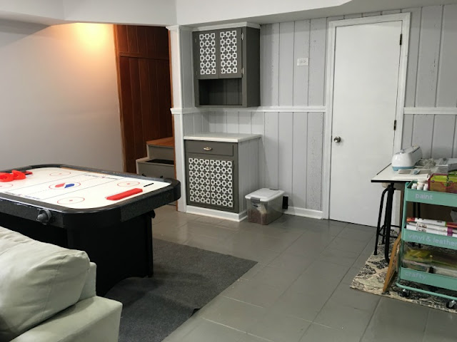 See how we took an ugly basement and turned it into a bright and cozy retreat along with adding laundry, bathroom, and mudroom spaces! Learn money saving tips and tricks from a DIYer.